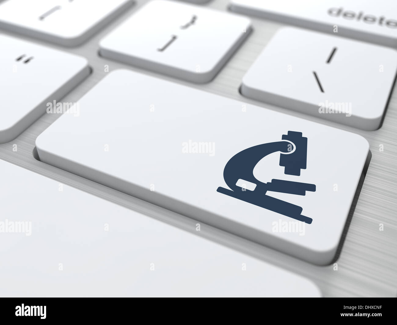 Clavier blanc avec bouton icône de microscope. Banque D'Images