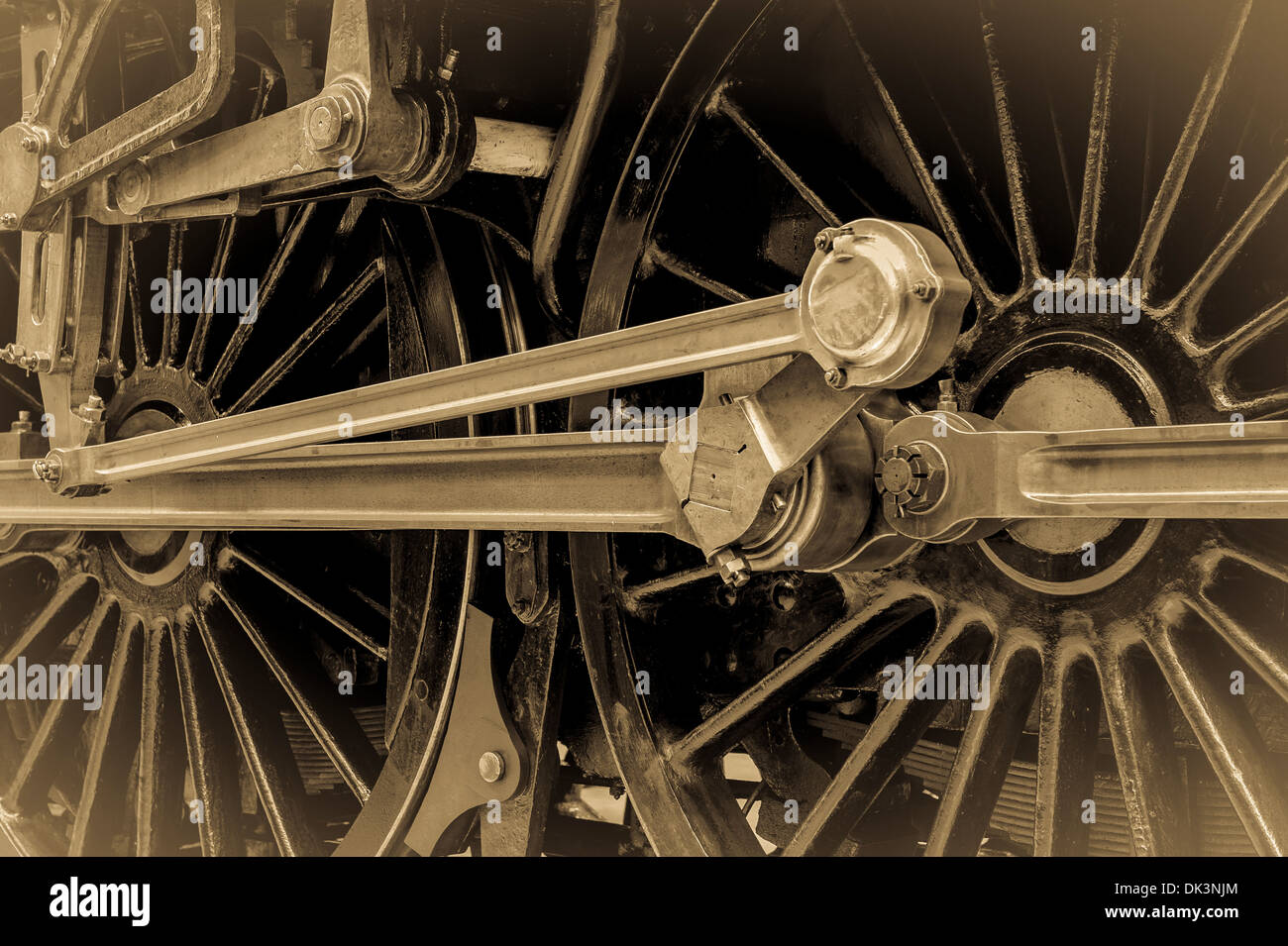 Les roues de train à vapeur avec piston et bielles. Un vintage effet sépia. Banque D'Images