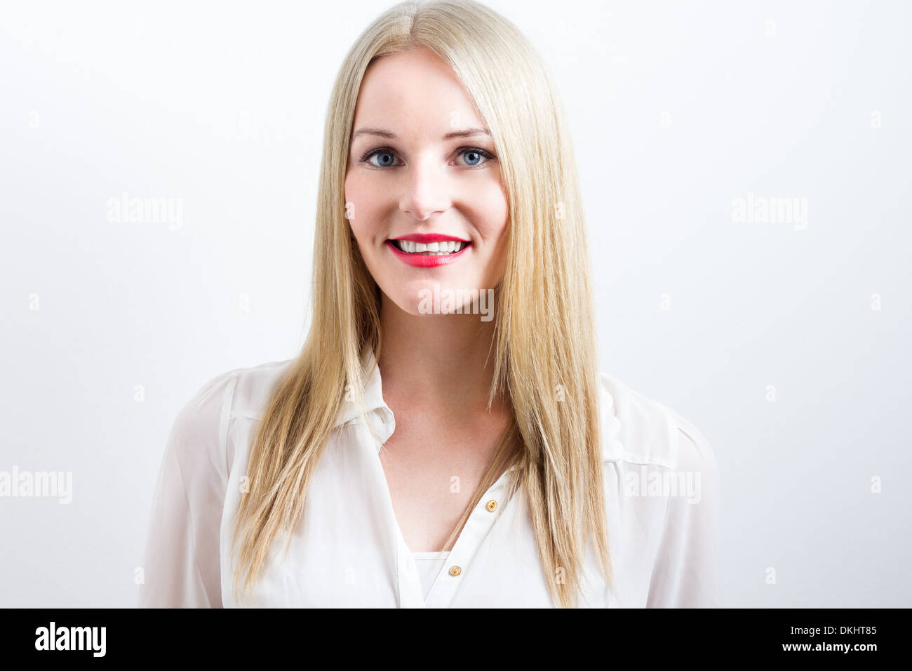 Smiling blonde young woman with red lips Banque D'Images