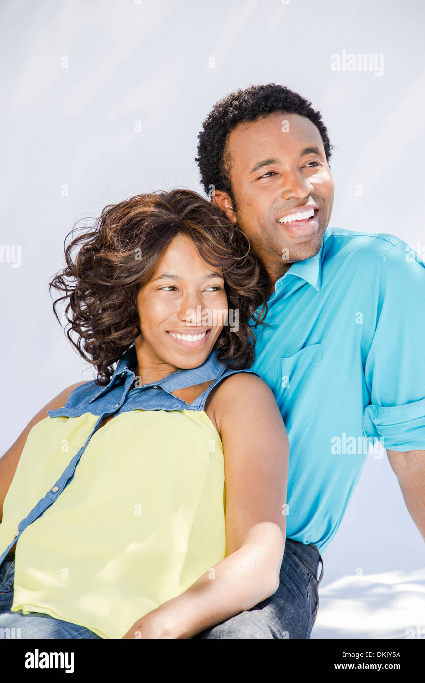 Happy young couple on white background Banque D'Images