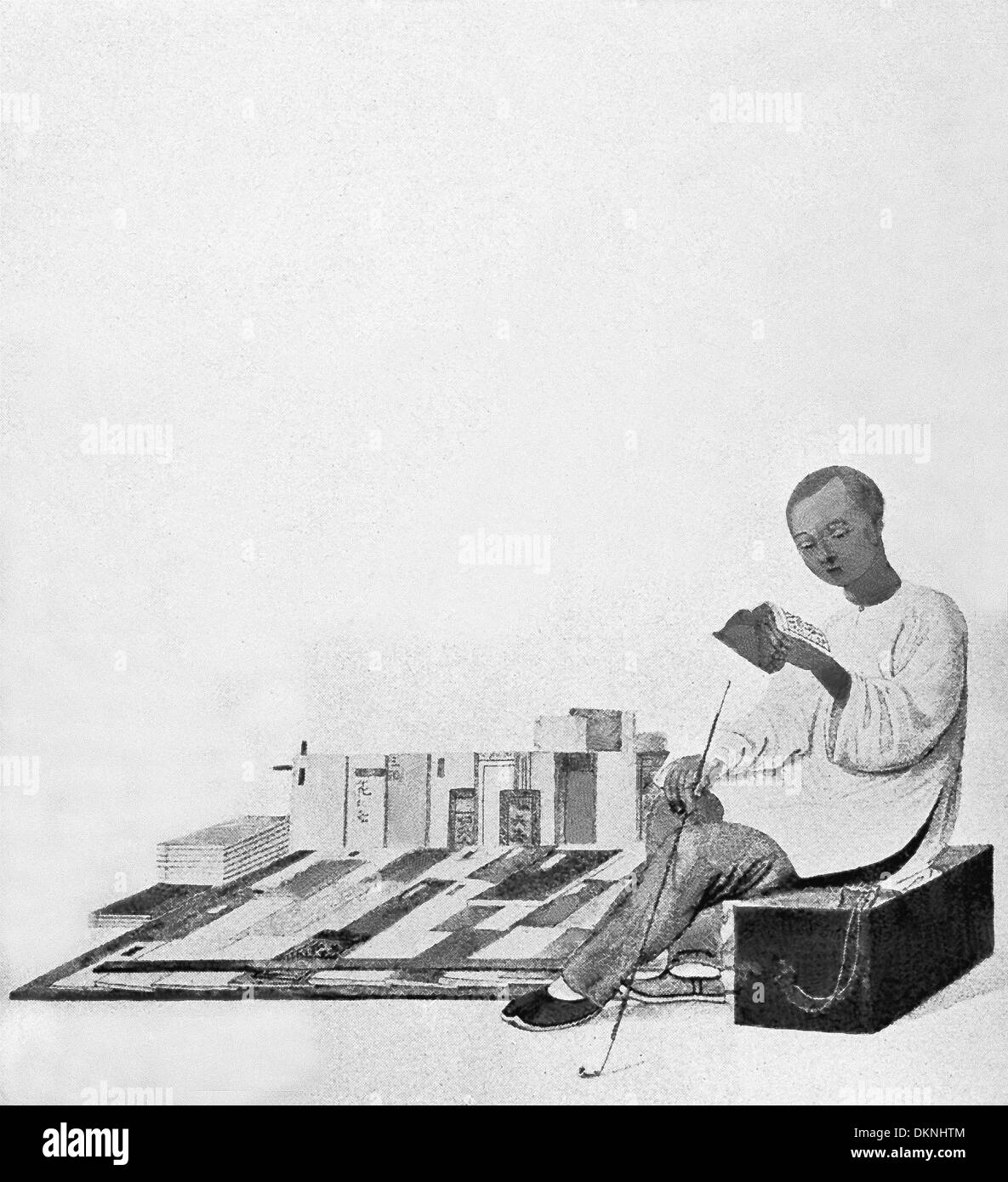 Cette illustration date de 1900 et montre un libraire en Chine. À l'époque, la dynastie des Qing était au pouvoir. Banque D'Images