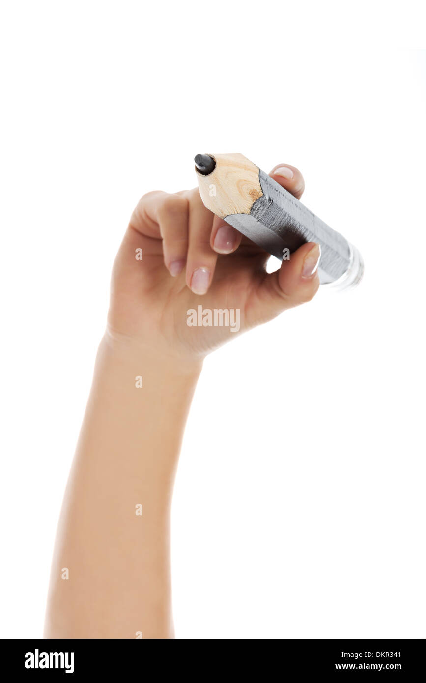 Woman's hand holding big est crayon et écrit sur l'exemplaire de l'espace. Isolé sur blanc. Banque D'Images