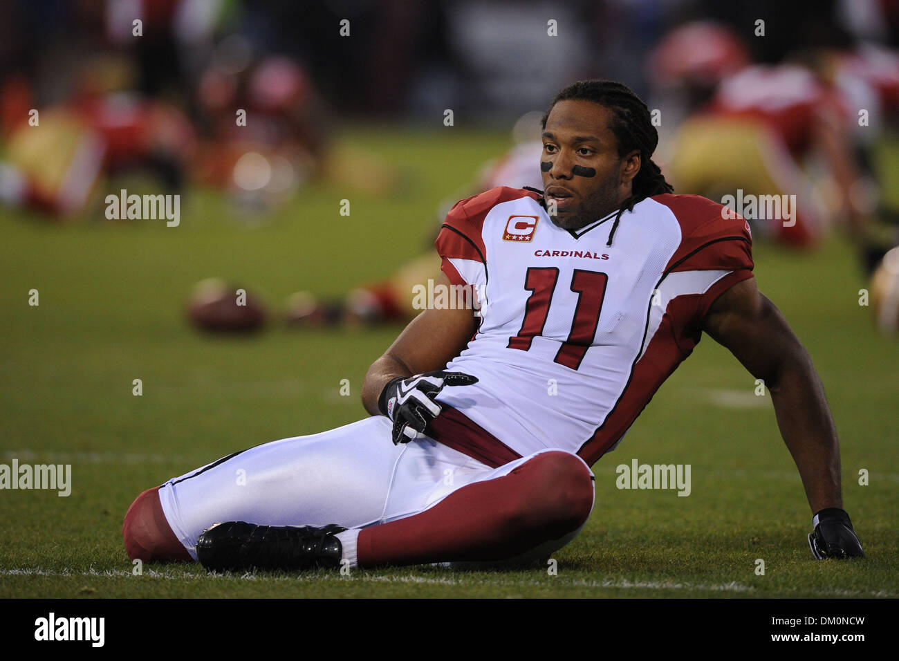 14 décembre 2009 - San Francisco, Californie, États-Unis - 14 décembre 2009 : Arizona Cardinals wide receiver Larry Fitzgerald (11) s'étend devant la NFL football match entre les Arizona Cardinals et San Francisco 49ers à Candlestick Park de San Francisco, en Californie. Les 49ers a gagné 24-9, en gardant leurs espoirs en séries dim tout en refusant les Cardinaux la NFC West intitulé. (Ima Crédit Banque D'Images