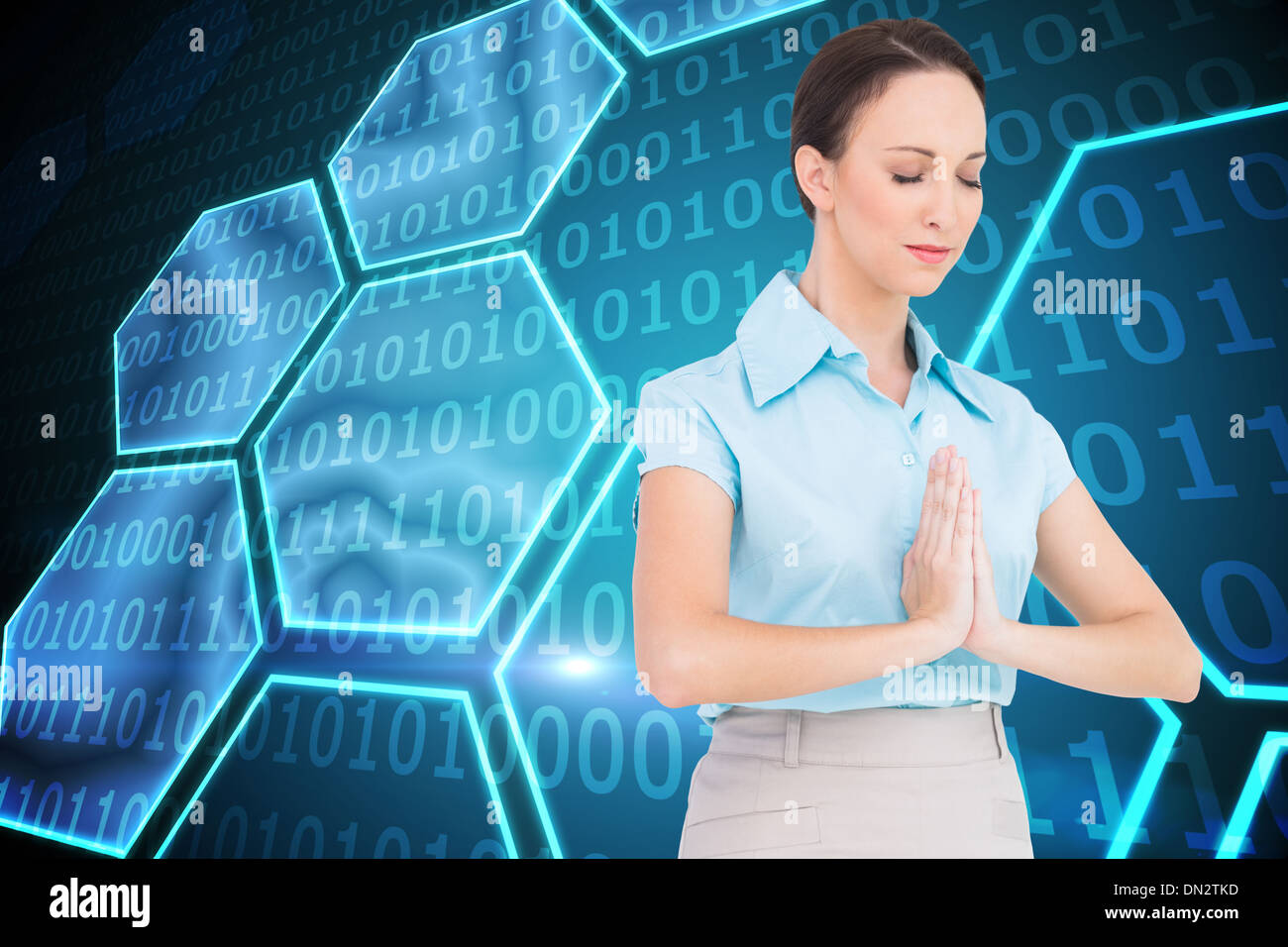 Image composite de la young businesswoman priant Banque D'Images