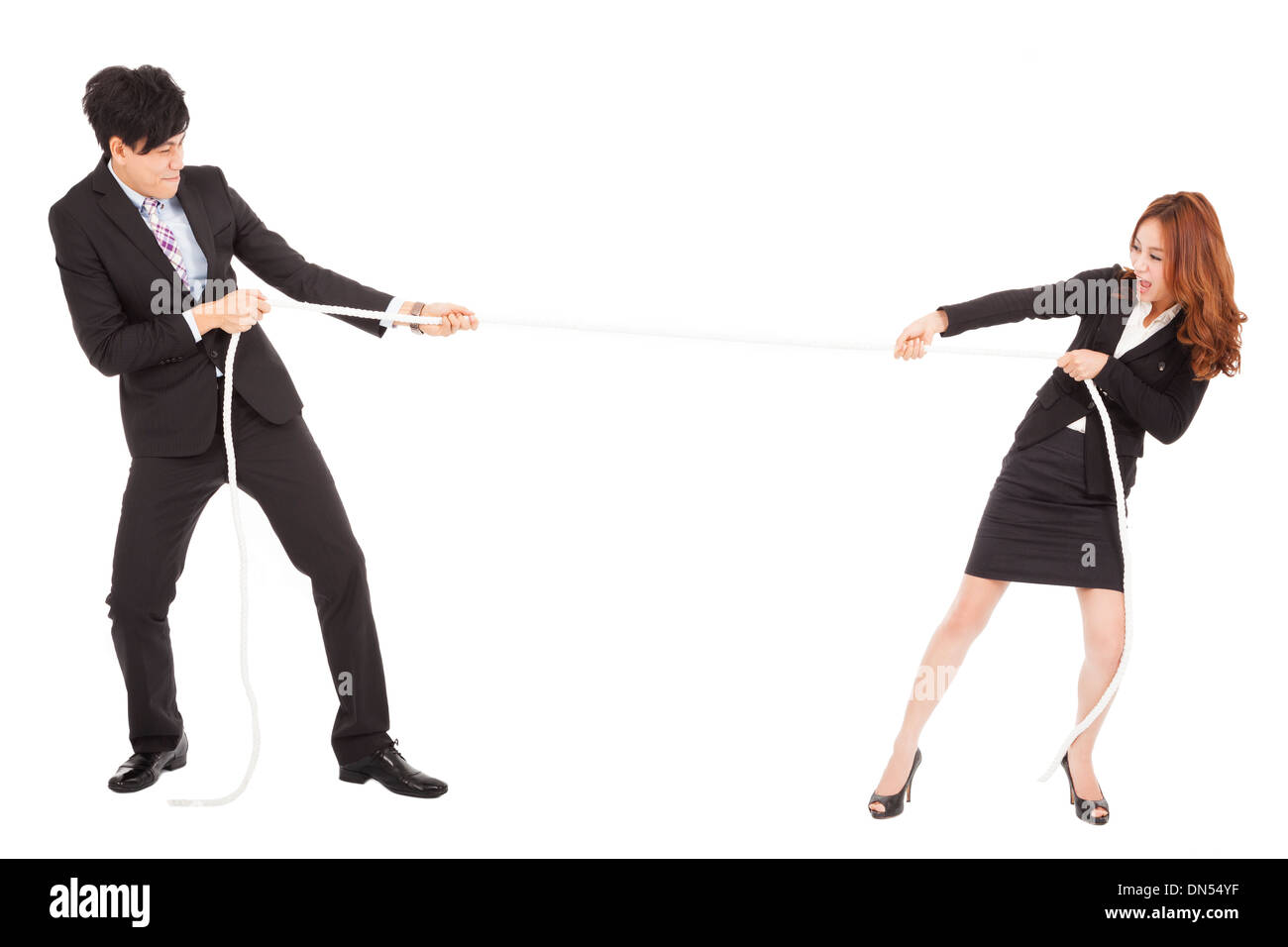 Businessman and woman playing Tug of War Banque D'Images