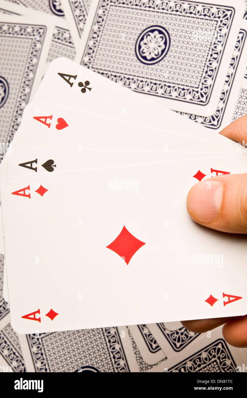 Hand holding a quatre as cartes à jouer Banque D'Images