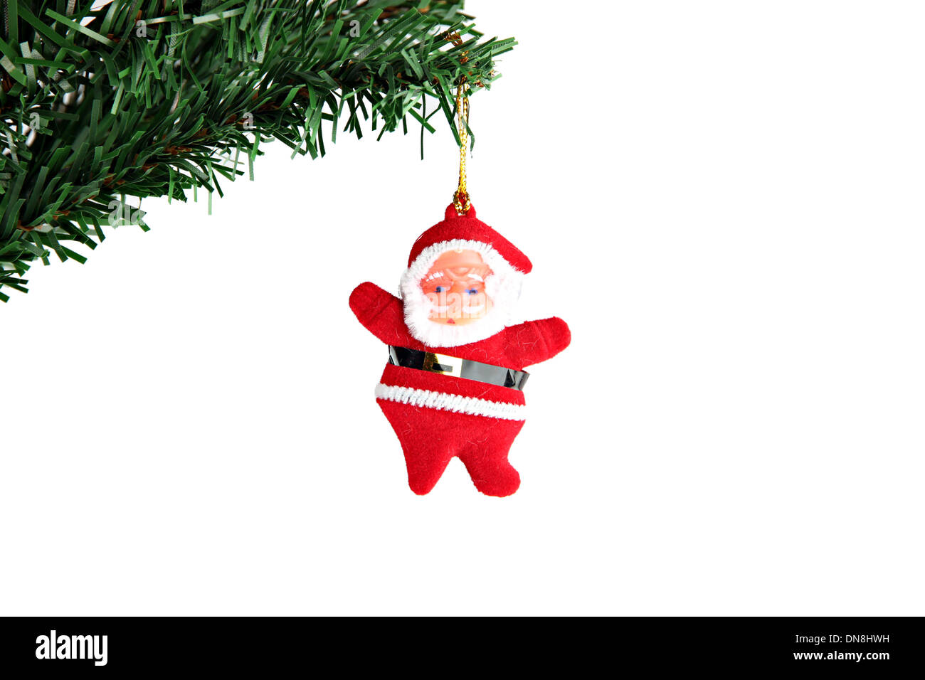 La photo Santa accroché sur une branche d'arbre de Noël. Banque D'Images