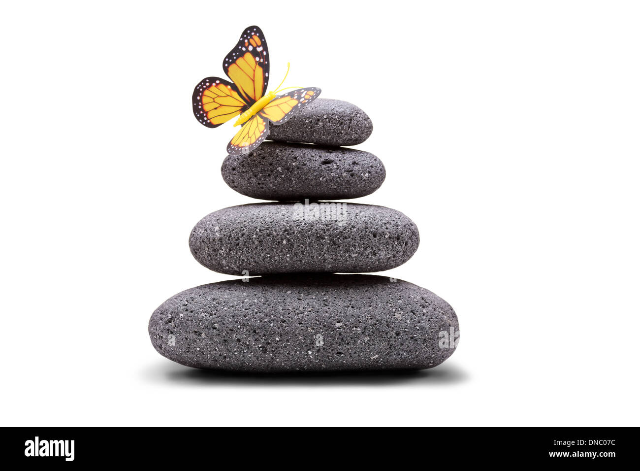 Papillon sur une pile de pierres équilibré Banque D'Images