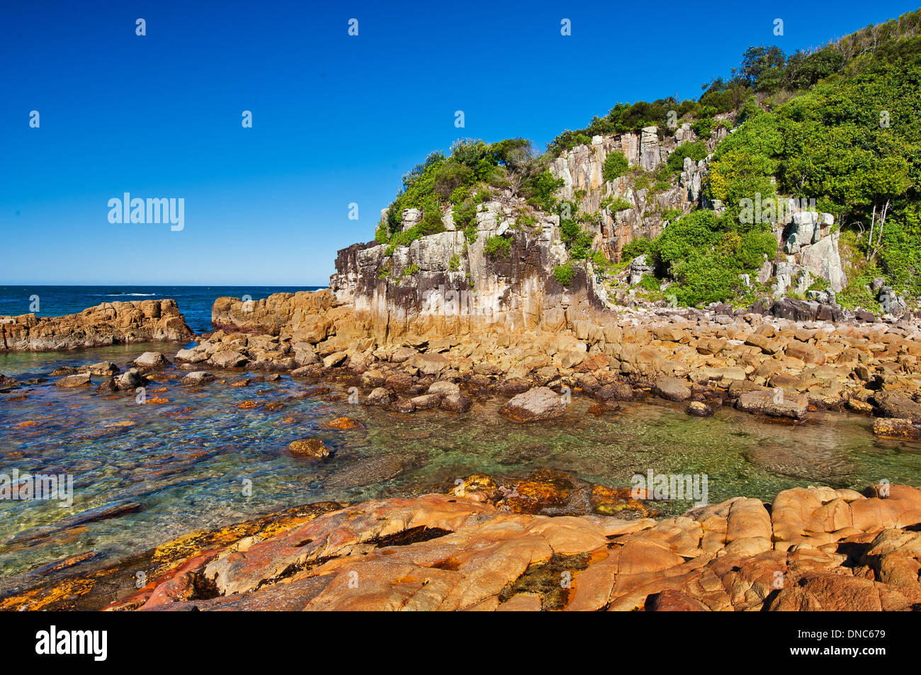 Falaises de la Tête du diamant dans la baie Crowdy Parc National. Banque D'Images