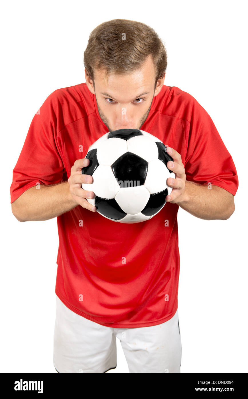 Joueur de football embrassant un ballon isolé dans White Banque D'Images