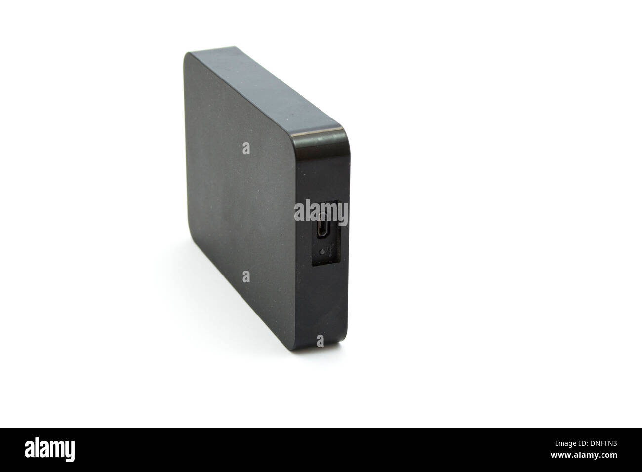 Disque dur Disque dur externe noir sur fond blanc Banque D'Images