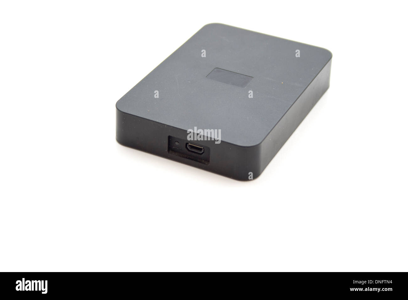 Disque dur Disque dur externe noir sur fond blanc Banque D'Images