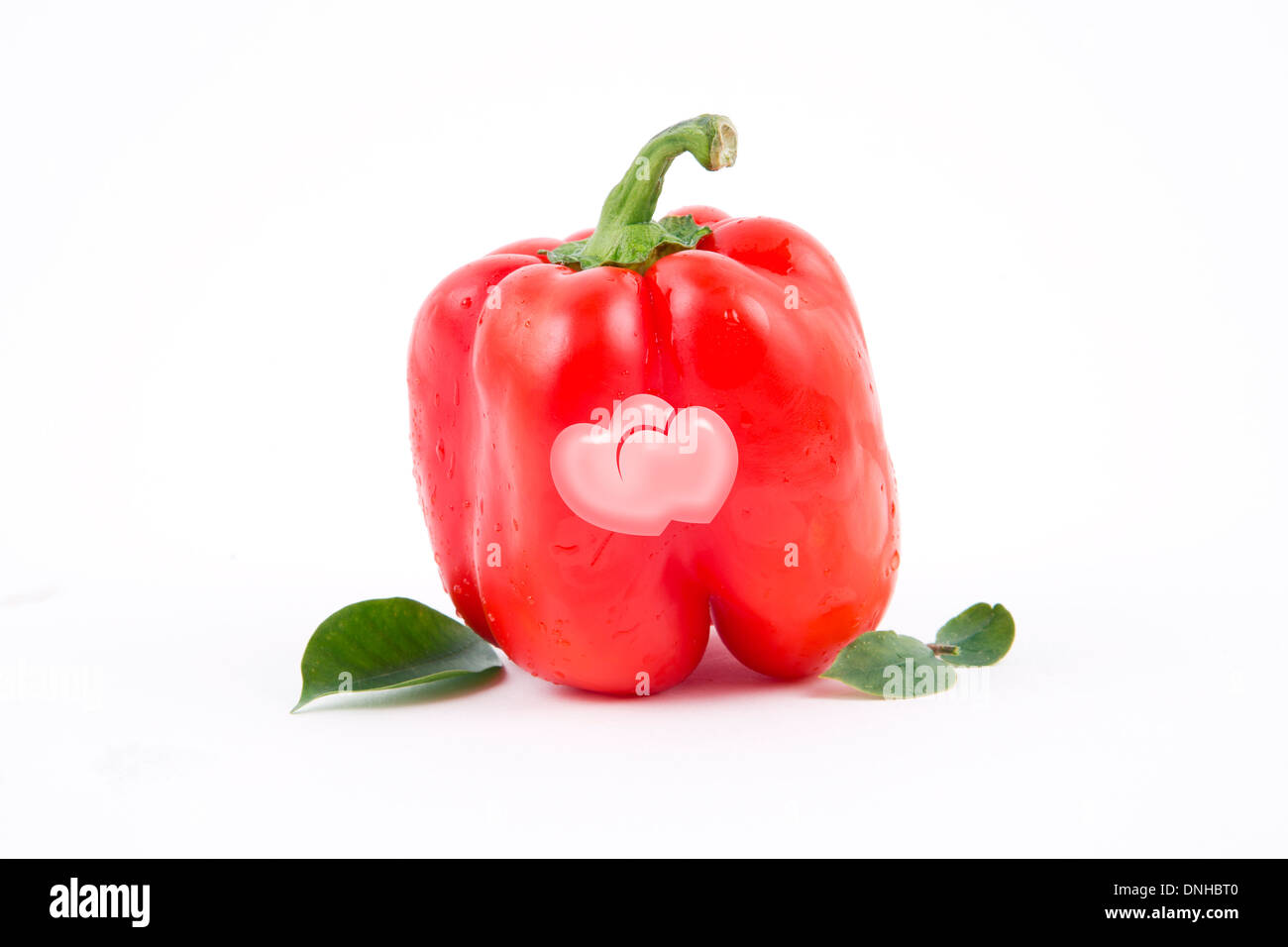 Deux cœurs sur le rouge paprika douce, un thème de Jour de Valentines Banque D'Images