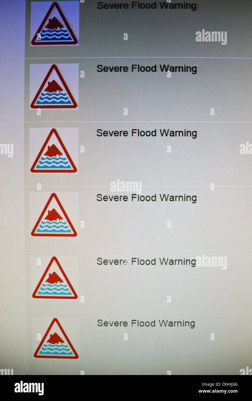 Des inondations graves avertissements figurant sur le site web de l'Agence de l'environnement au moment de la marée au Royaume-Uni, en 2013. Banque D'Images