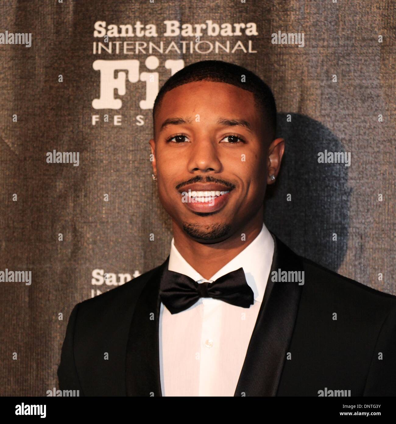 Santa Barbara, Californie, USA - 5 janvier 2014. Le tapis rouge pour les arrivées de Santa Barbara International Film Festival's Kirk Douglas Award for Excellence in film présenté à Forest Whitaker à un noir de gala tenu à la Bacara Resort & Spa. Photo : Michael B. Jordan du film Fruitvale Station. Credit : Lisa Werner/Alamy Live News Banque D'Images