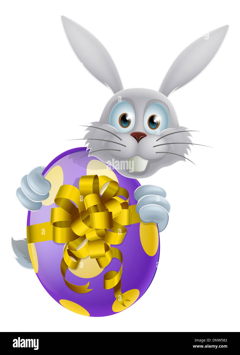 Un lapin de Pâques peeking autour d'un décor géant de Pâques en chocolat avec un arc Banque D'Images