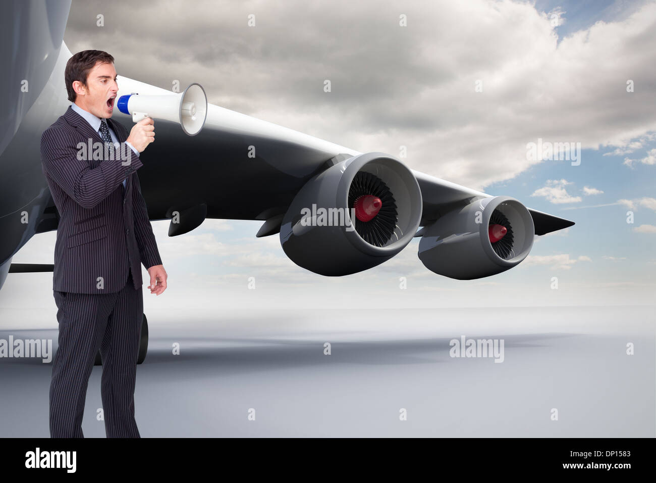 Image composite de standing businessman shouting through a megaphone Banque D'Images