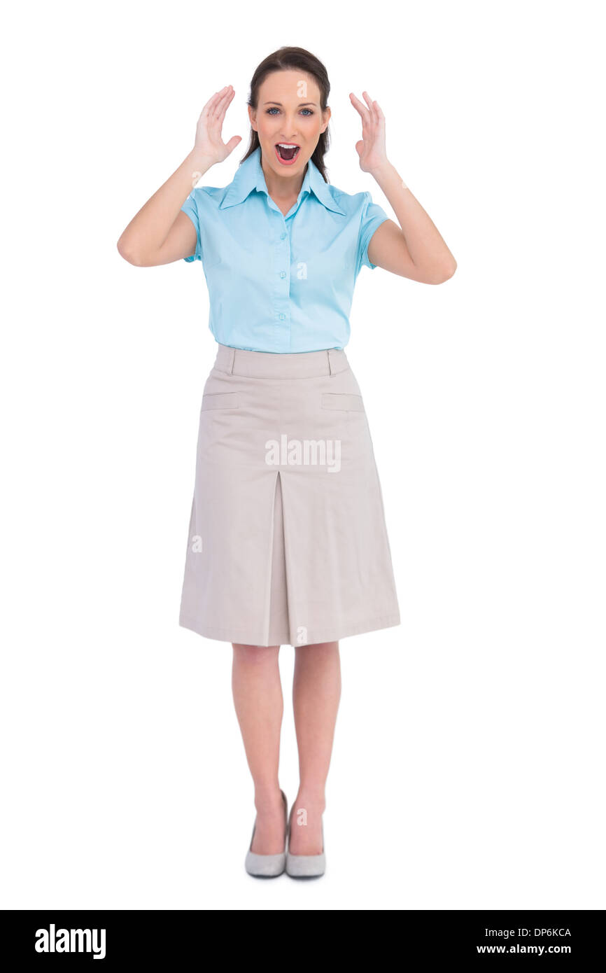 Élégant surpris businesswoman posing Banque D'Images