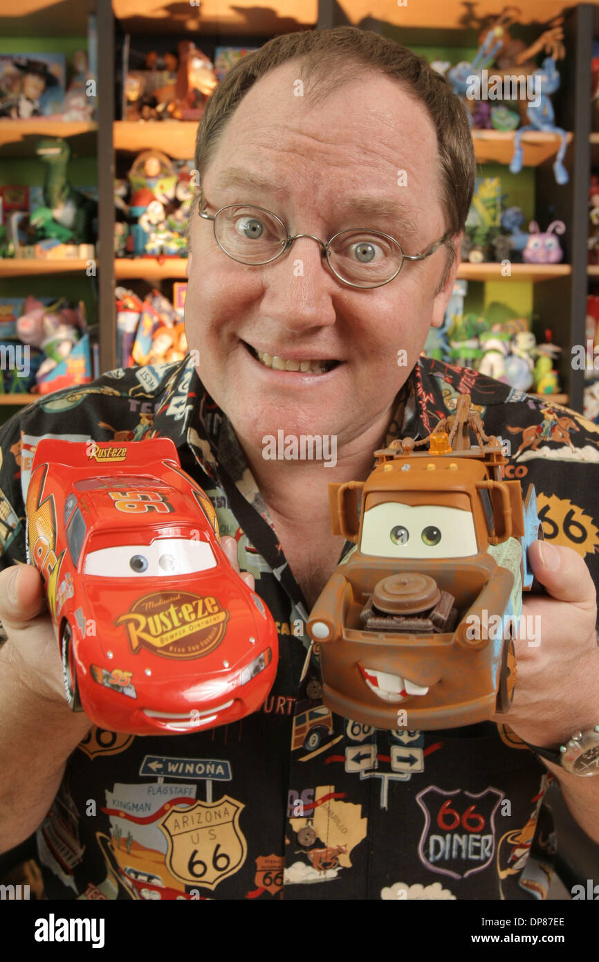 Mar 02, 2006 - Emeryville, Californie, USA - John Lasseter, 49 ans,  scénariste/réalisateur de l'animated motion photo 'Cars', pose dans son bureau  de Pixar avec des jeux basés sur les personnages du