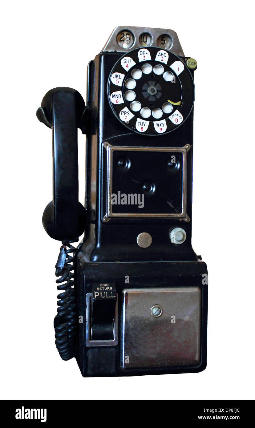 Droit d'un antique téléphone payant rotatif isolé sur un fond blanc. Banque D'Images