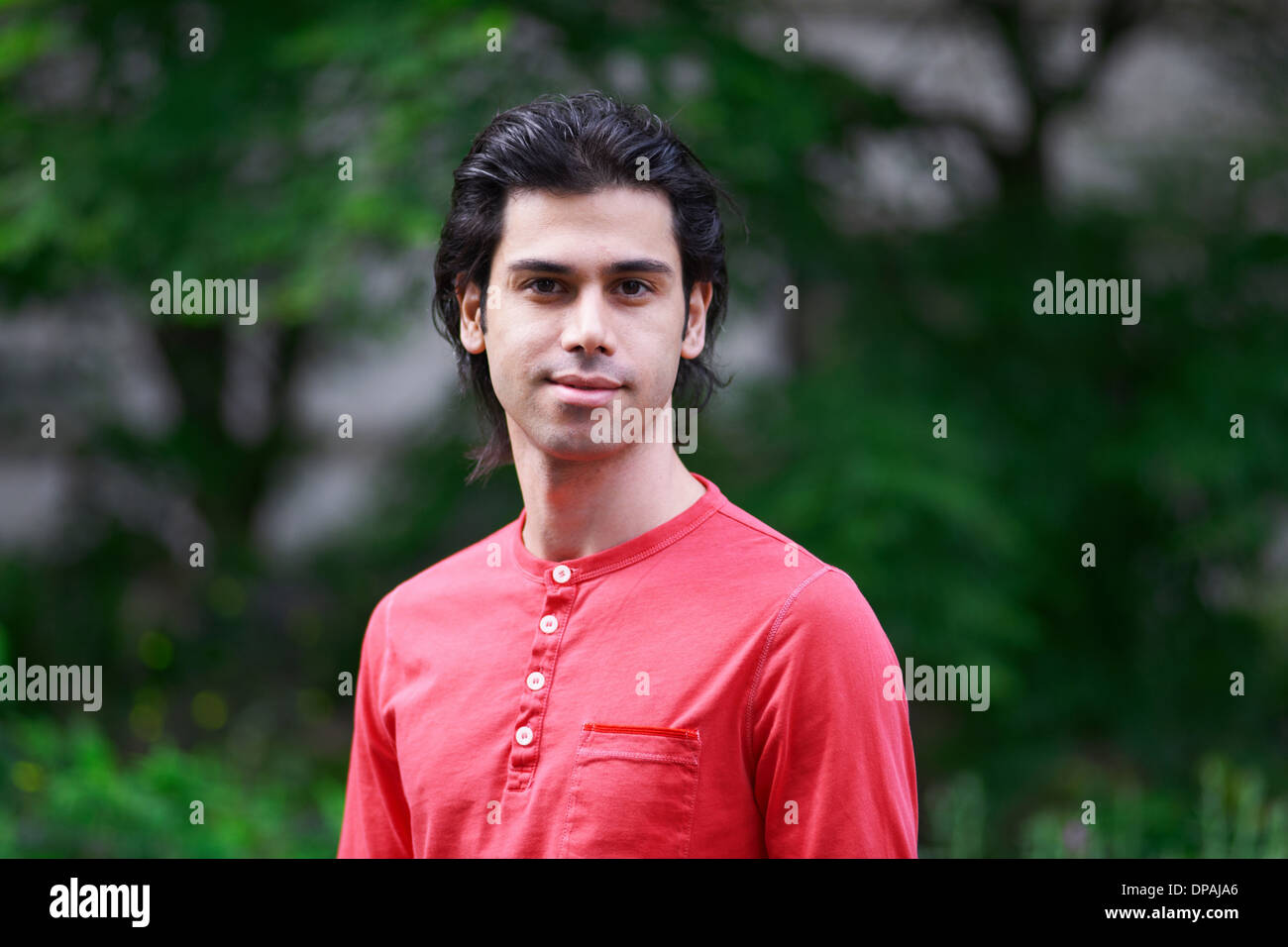 Portrait of young man wearing red top Banque D'Images