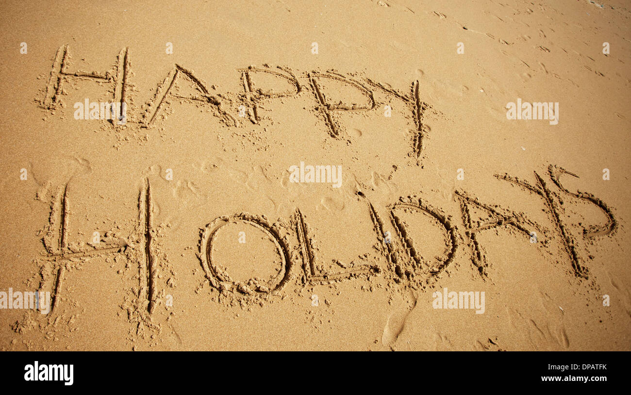 Message ou message d'écrit dans le sable à la plage Banque D'Images