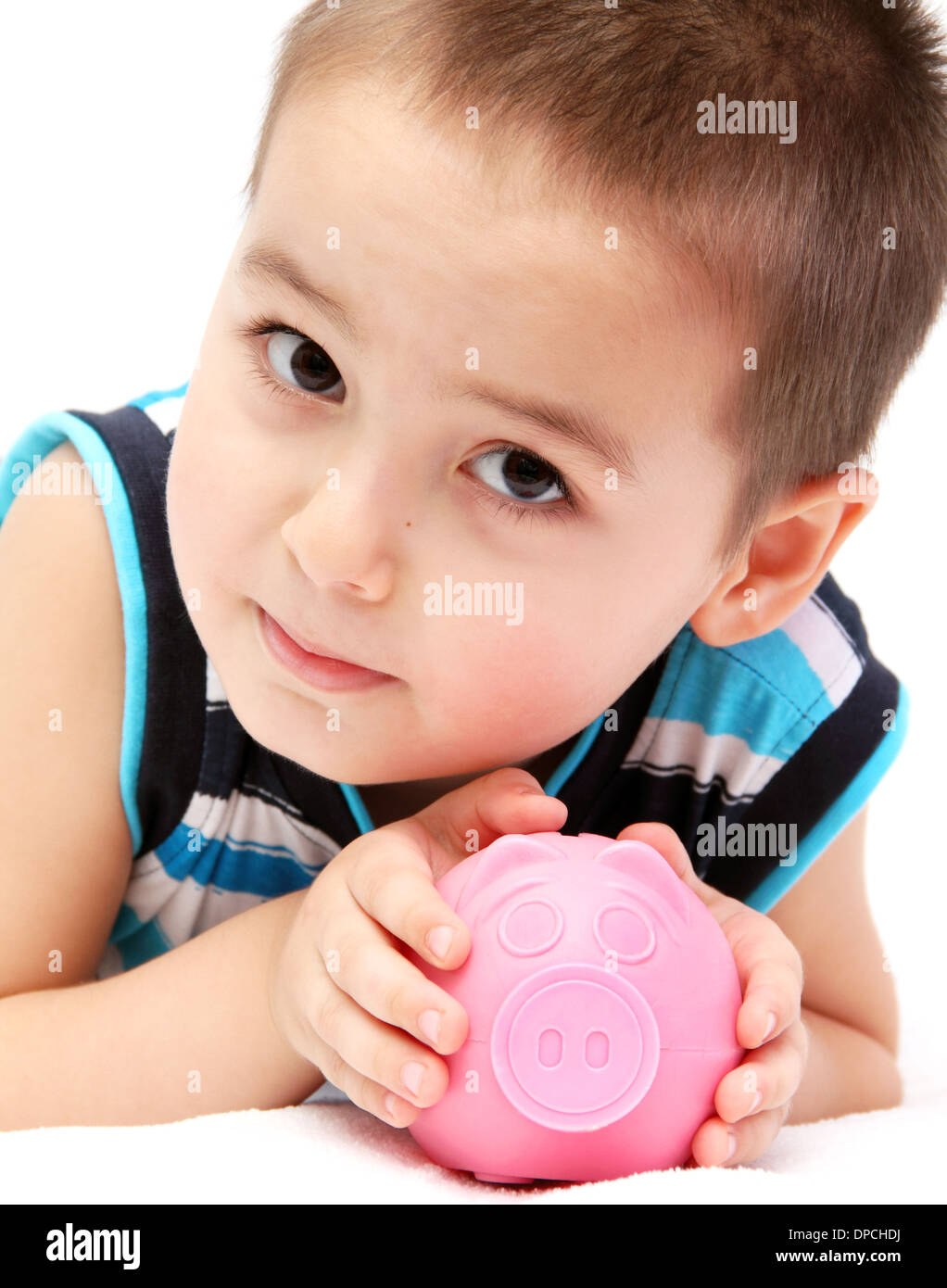 Child holding piggy bank Banque D'Images