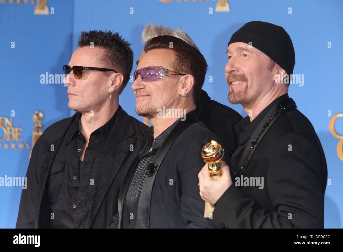Los Angeles, Californie, USA. 12 janvier 2014. Larry Mullen Jr. (l-r), Bono et The Edge de U2 de poser dans la salle de presse de la 71e Golden Globe Awards annuels aka Golden Globes à l'hôtel Beverly Hilton à Los Angeles, USA, le 12 janvier 2014. Photo : Hubert Boesl/dpa/Alamy Live News Banque D'Images
