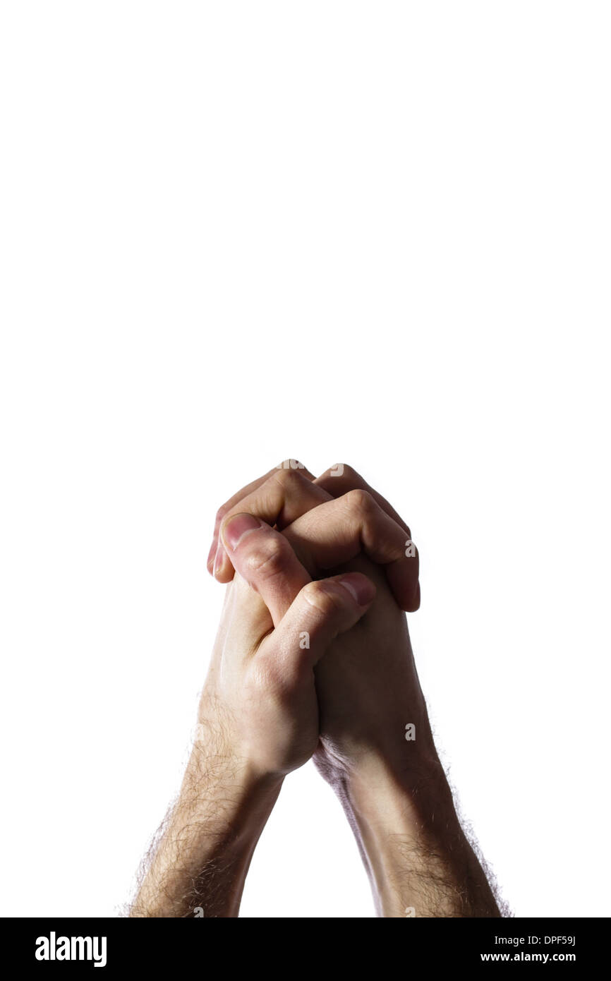 Mains jointes pour une prière isolé sur fond blanc Banque D'Images