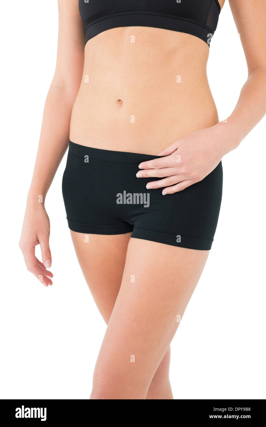Close-up mid section of a fit woman in sportswear Banque D'Images