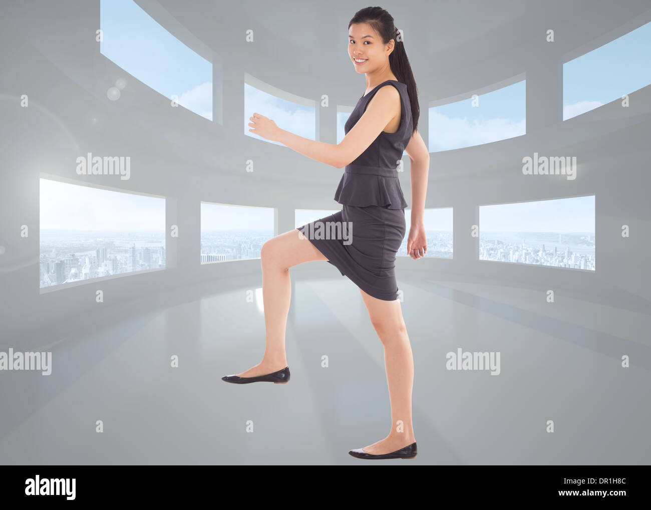 Composite image of businesswoman stepping up Banque D'Images