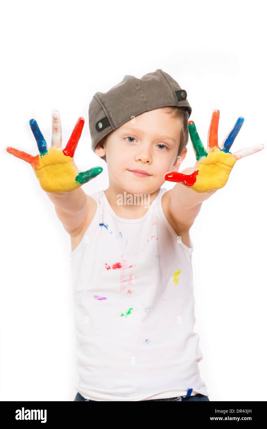Petit garçon aux mains dans la peinture isolated on white Banque D'Images
