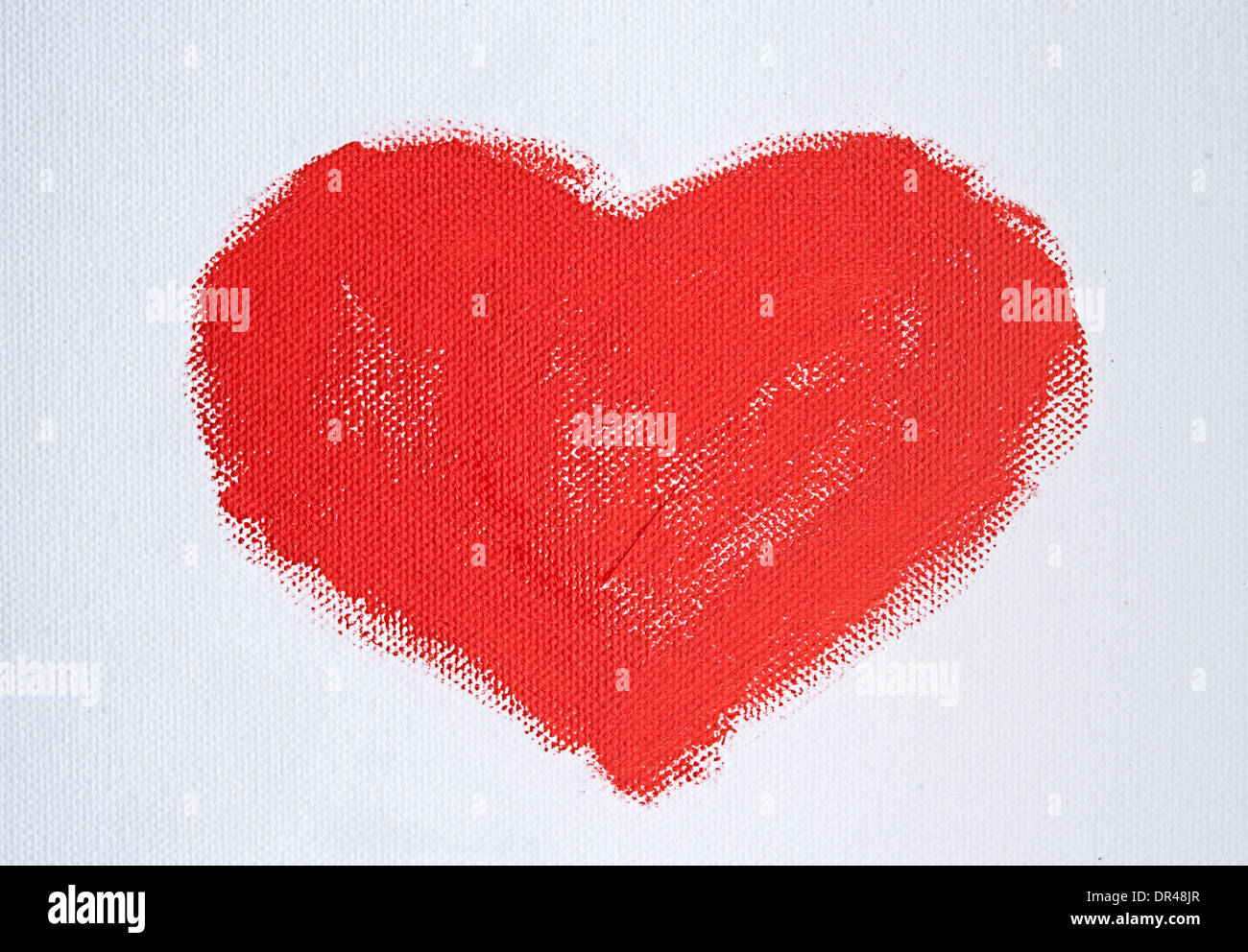 Coeur rouge peint avec peinture acrylique sur toile blanche Banque D'Images