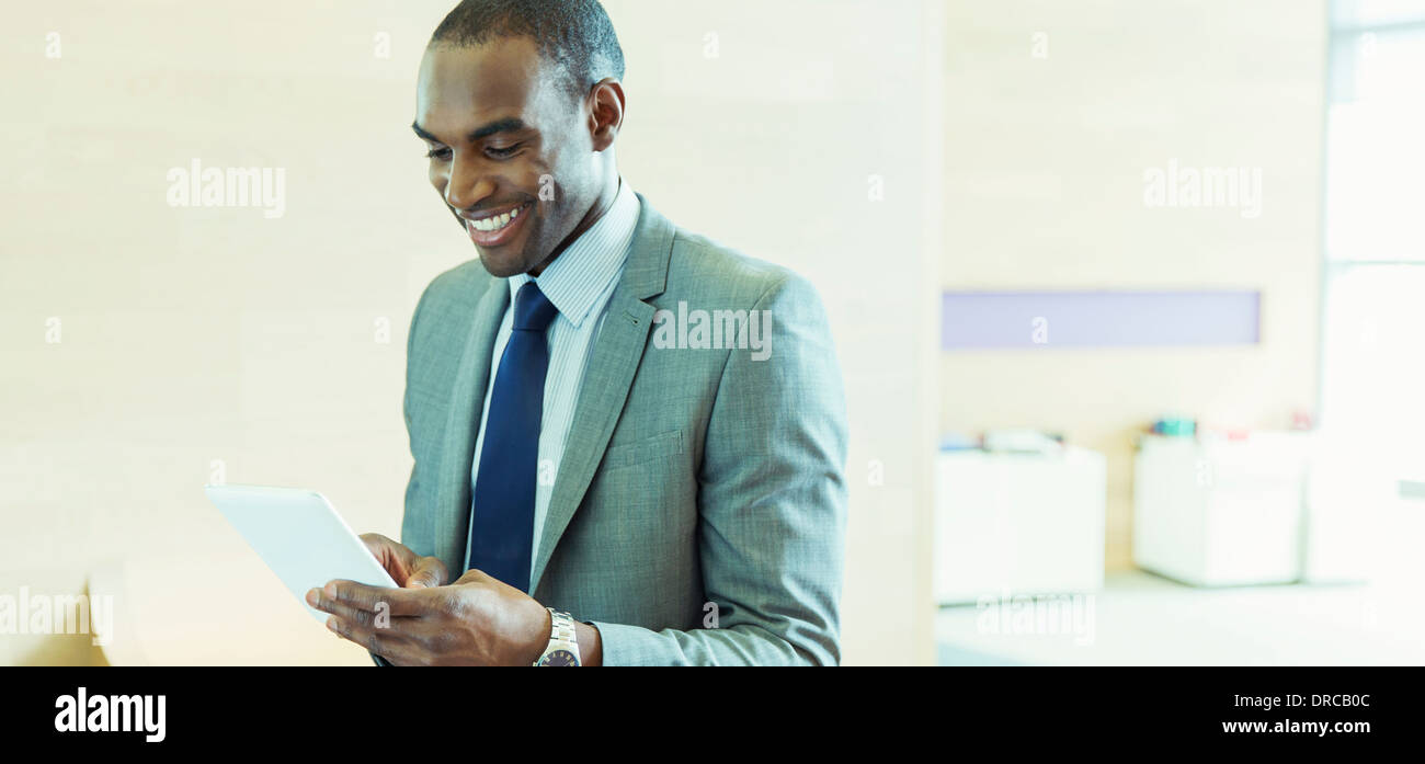 Businessman using digital tablet in office Banque D'Images