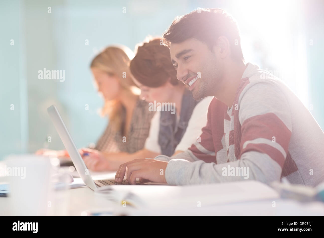 University Student using laptop in classroom Banque D'Images