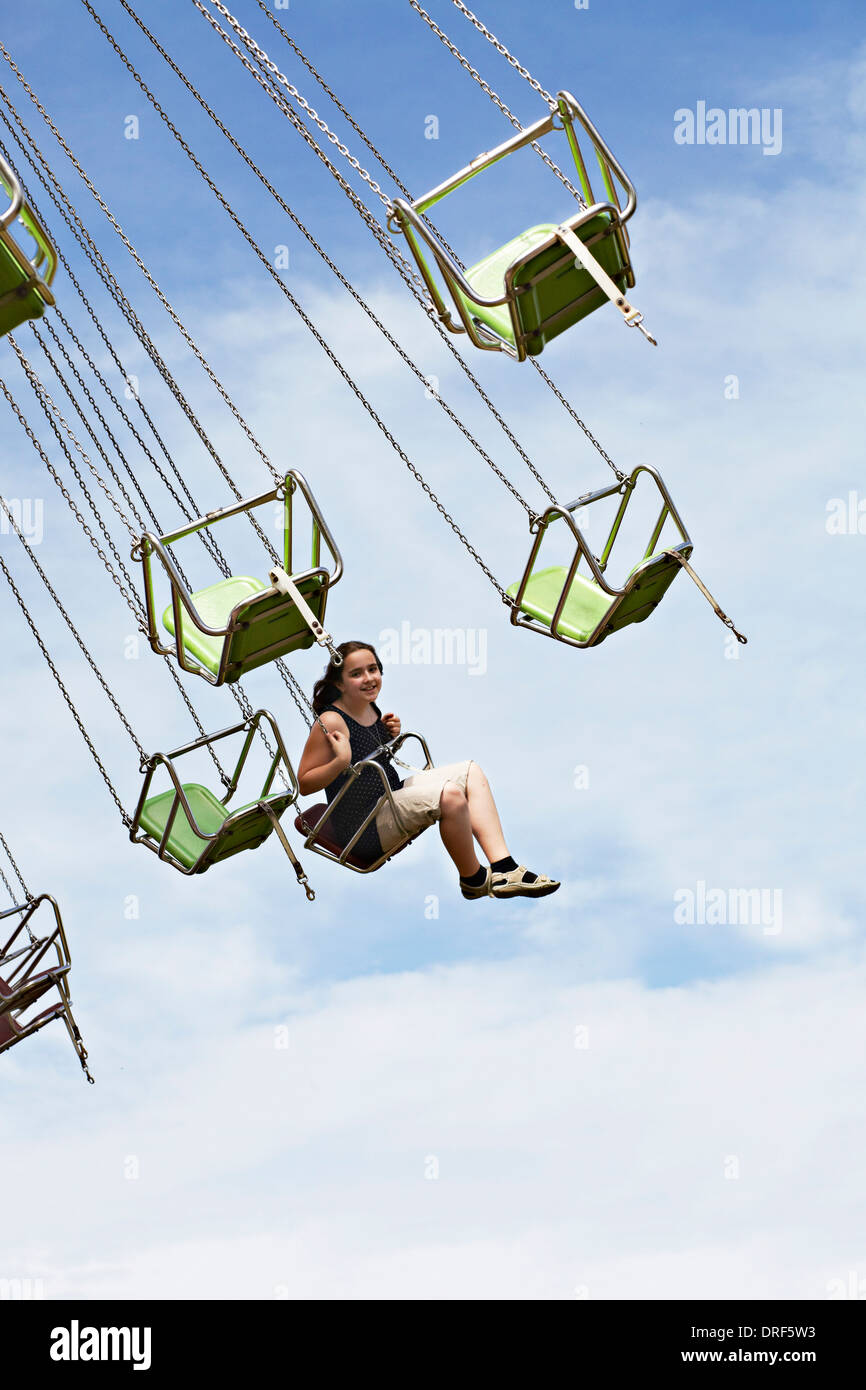 Gril Sitting in Amusement Park Ride, Bad Woerishofen, Bavaria, Germany, Europe Banque D'Images