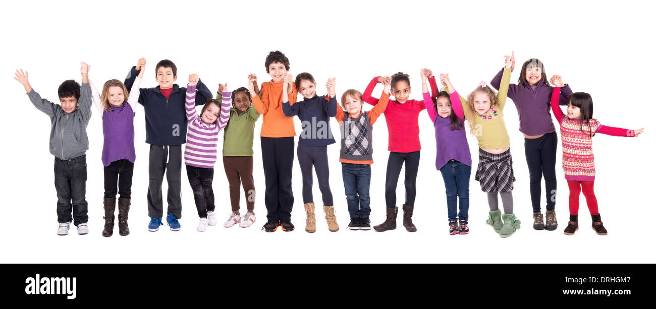 Groupe d'enfants posant avec les mains en isolé dans White Banque D'Images