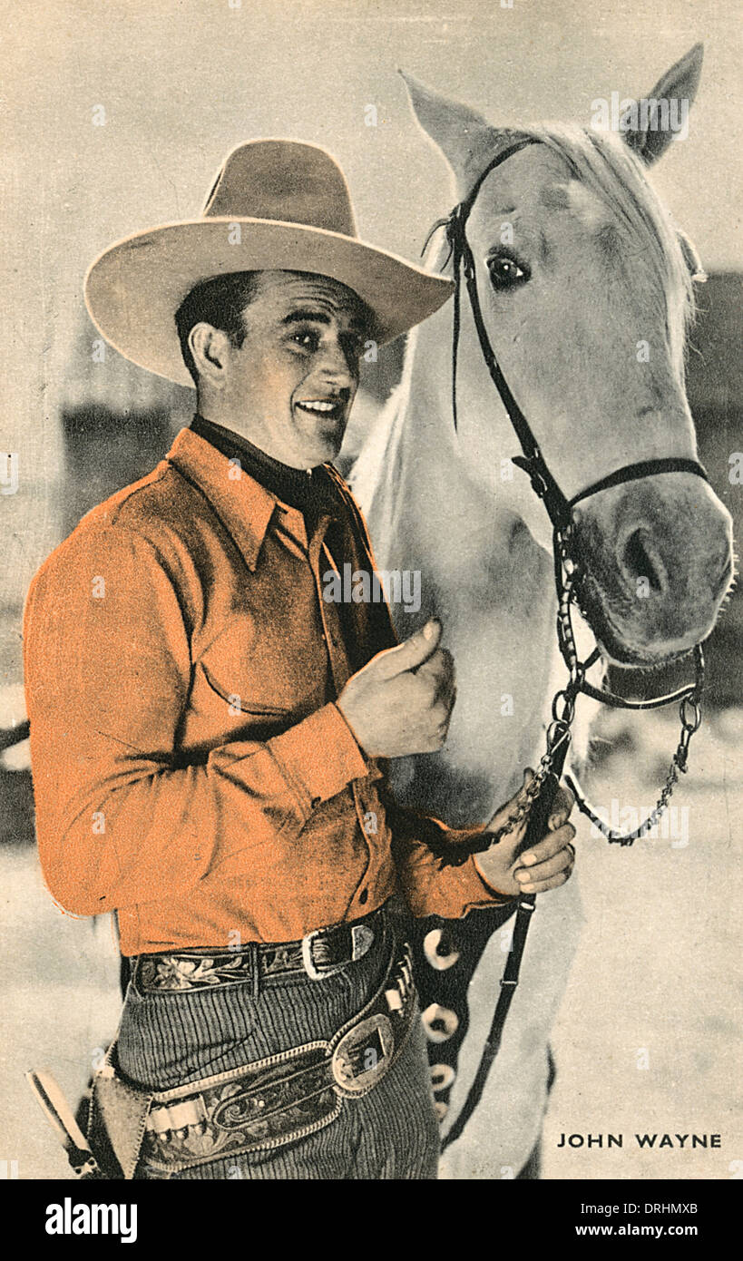 John Wayne, la star de cinéma américain, à cheval Banque D'Images