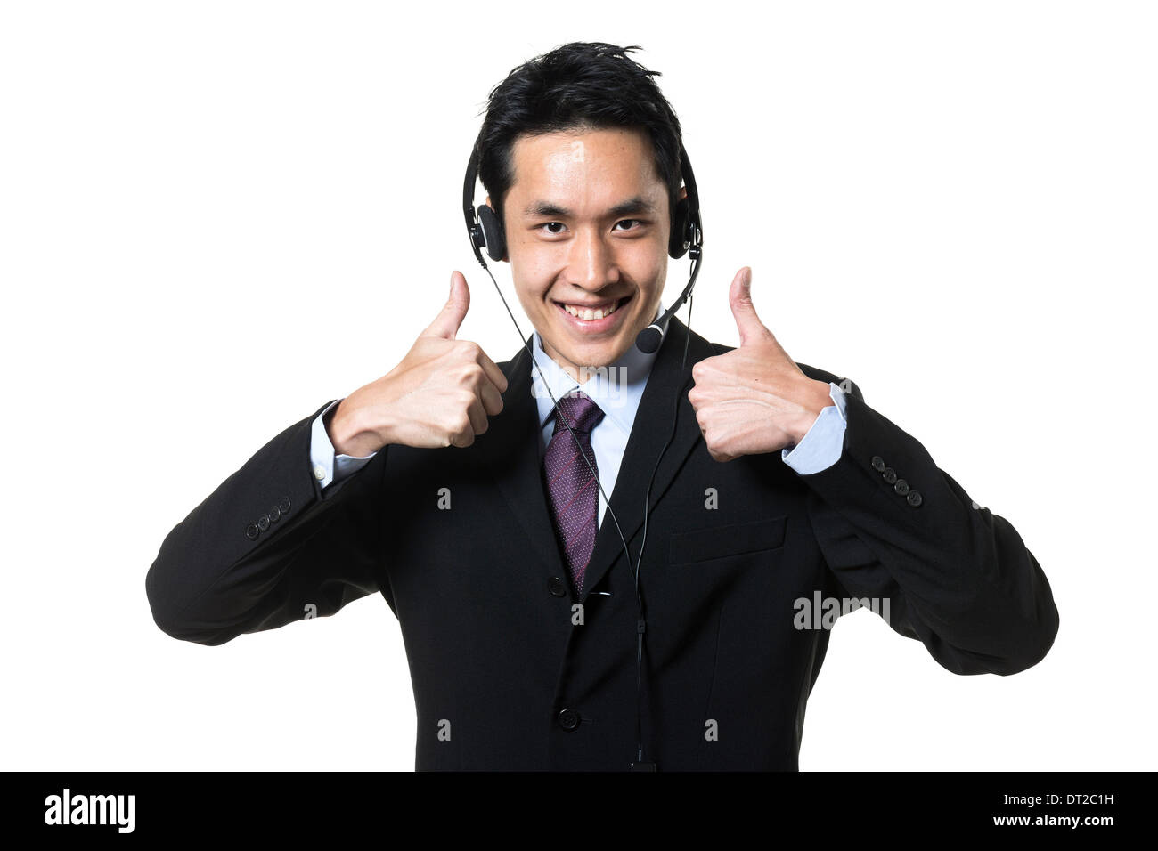 Homme d'affaires chinois, agent du centre d'appels de porter un casque. Isolé sur un fond blanc. Banque D'Images