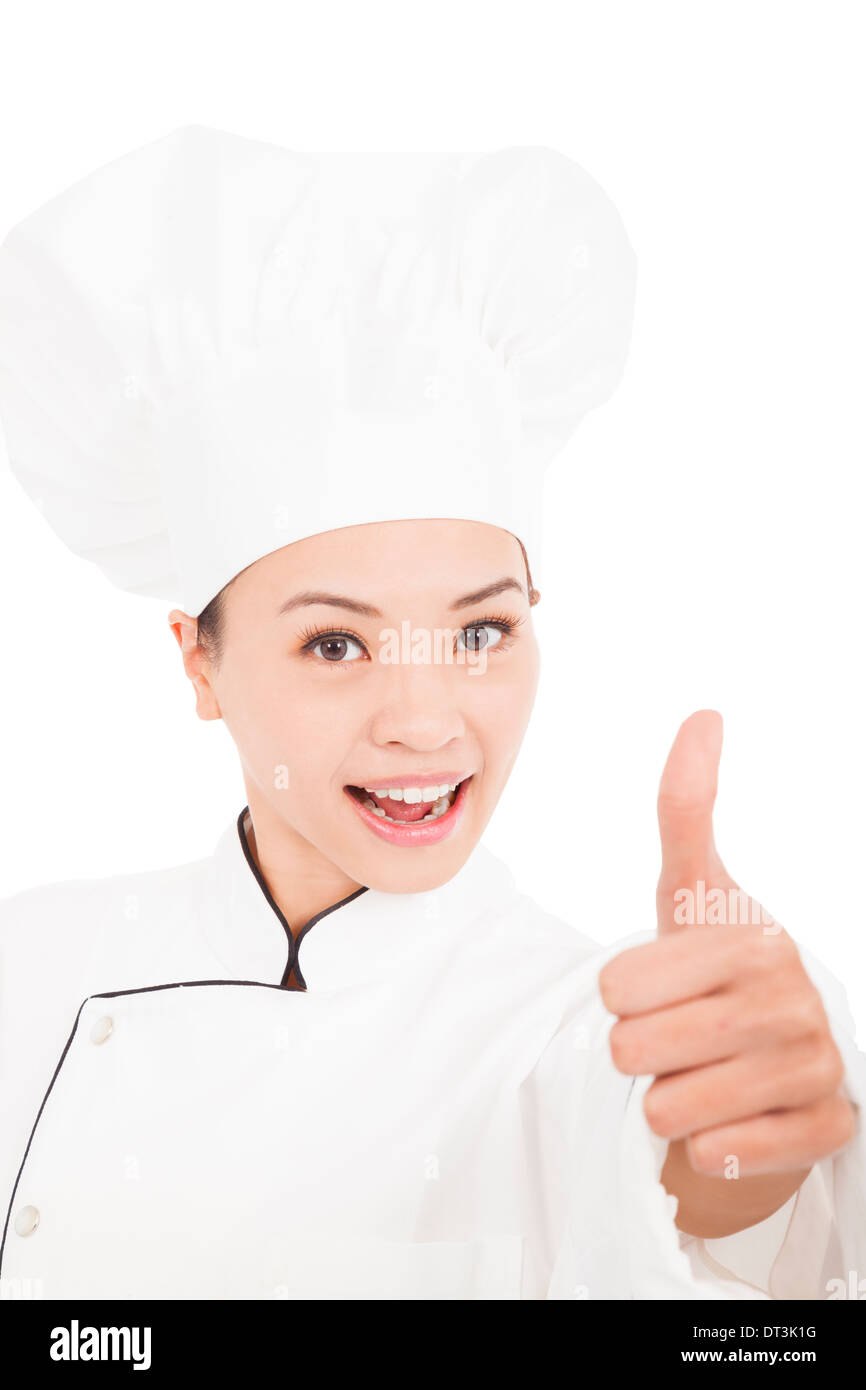Smiling female chef, cuisinier ou baker showing Thumbs up Banque D'Images