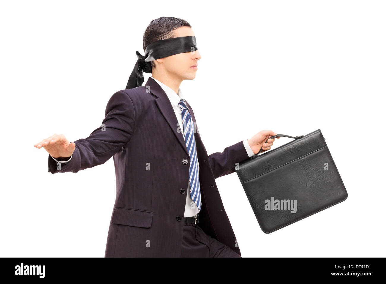 Les yeux bandés young businessman with briefcase Banque D'Images