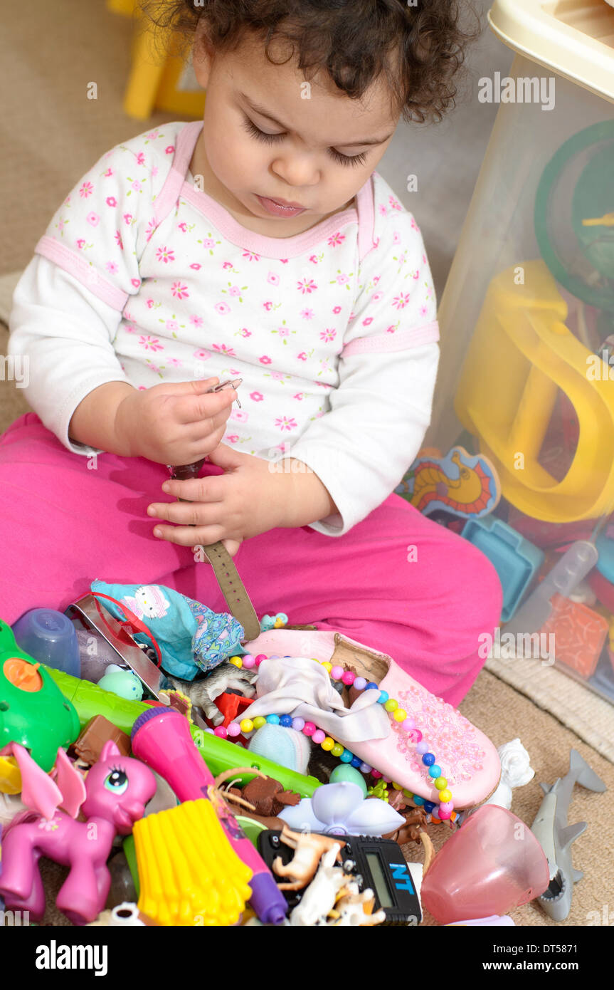 Baby Girl Playing with Toys at Home Banque D'Images