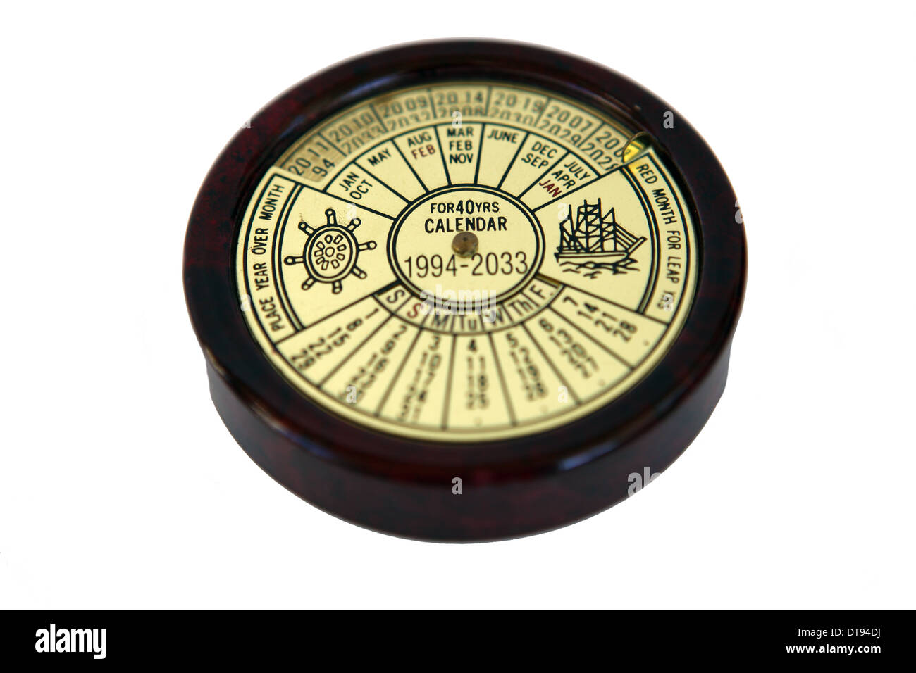 Calendrier de l'année 40 en laiton 1994 - 2033 on a white background Banque D'Images