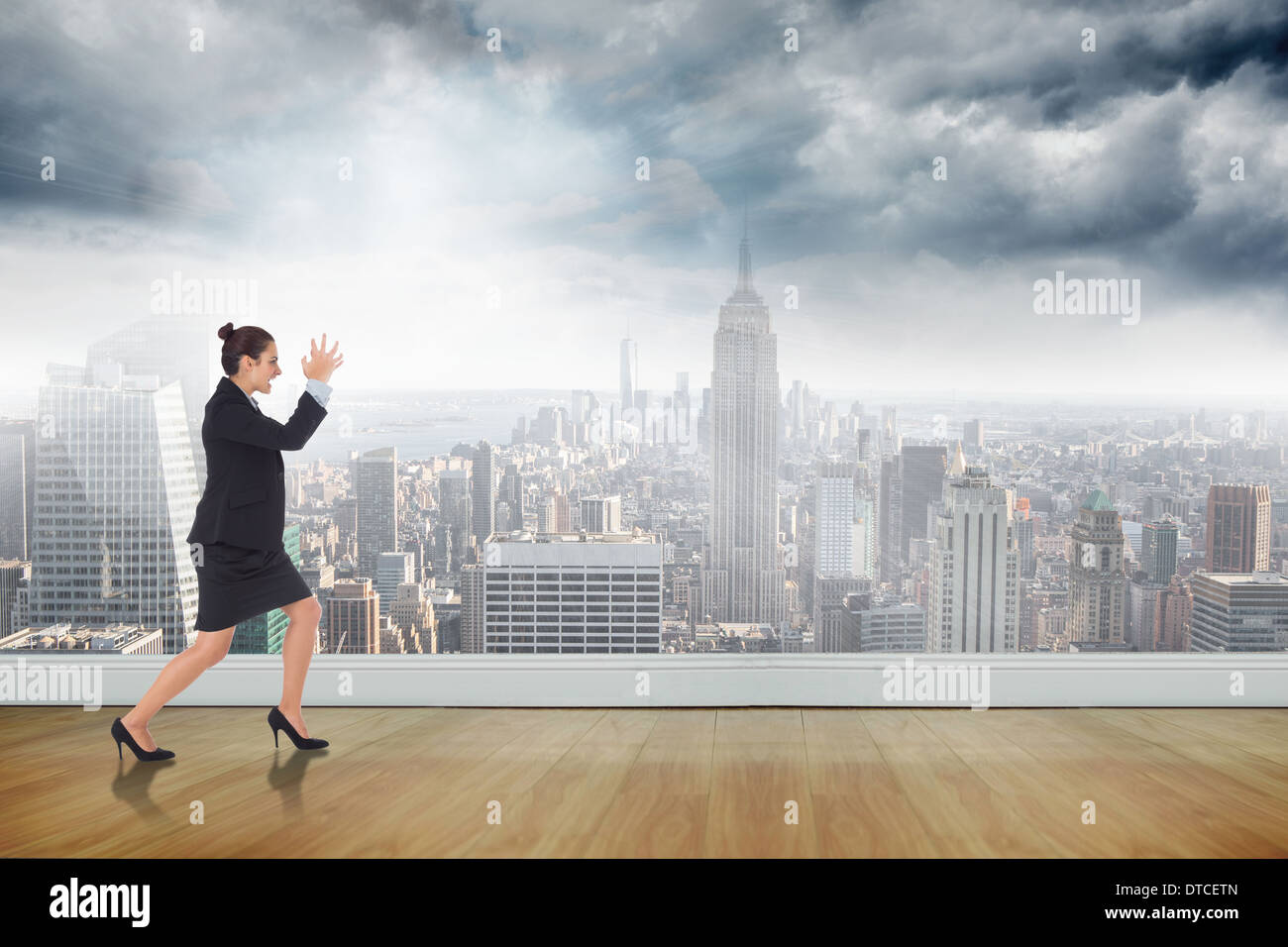 Image composite de angry businesswoman gesturing Banque D'Images