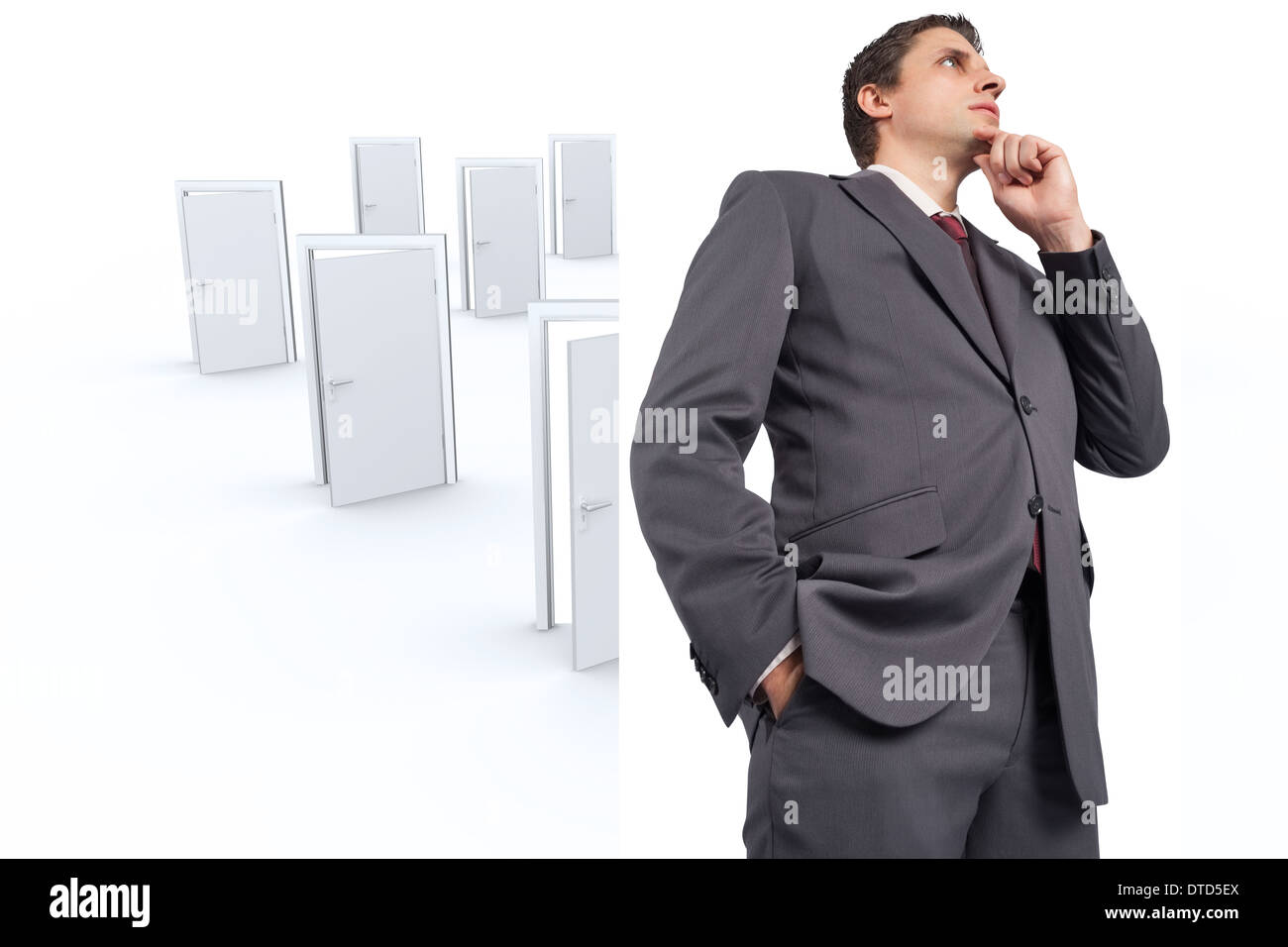 Composite image of businessman with hand on chin Banque D'Images