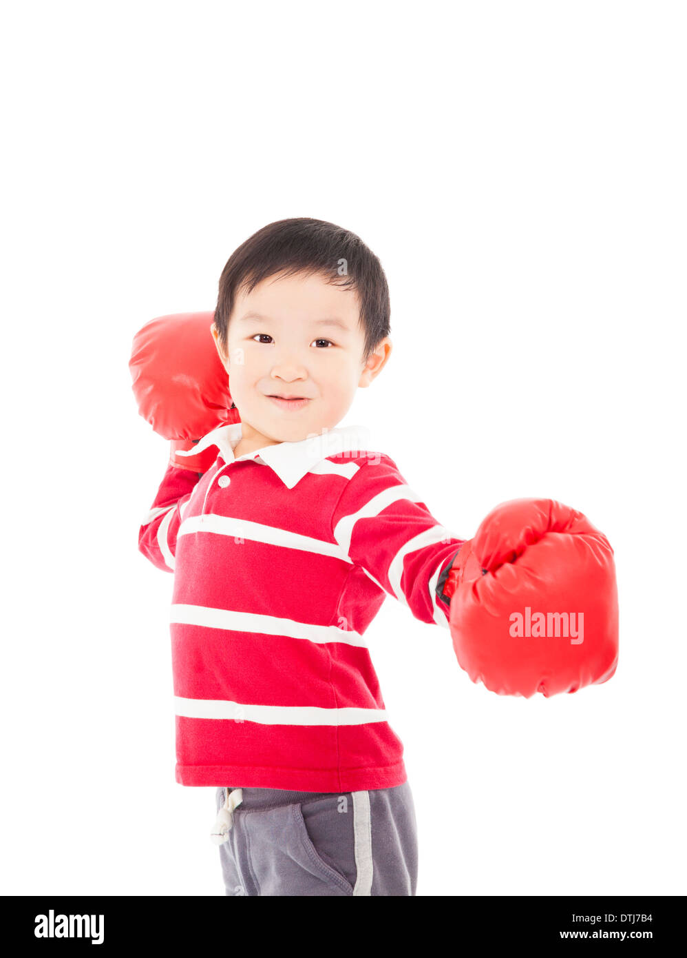 Portrait of a cute boy sportif in boxing gloves in studio Banque D'Images