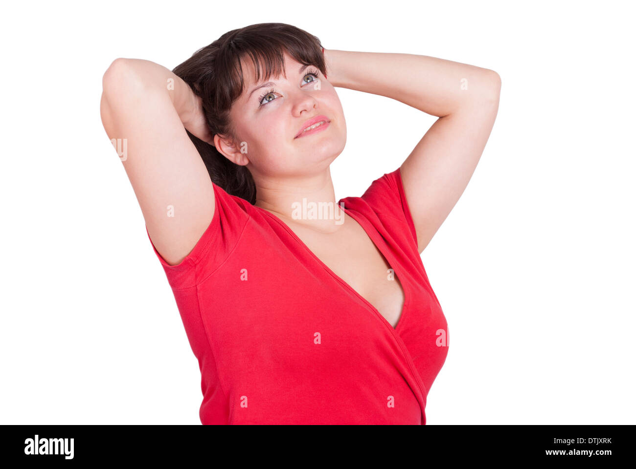 Happy girl touching hair looking up. Banque D'Images