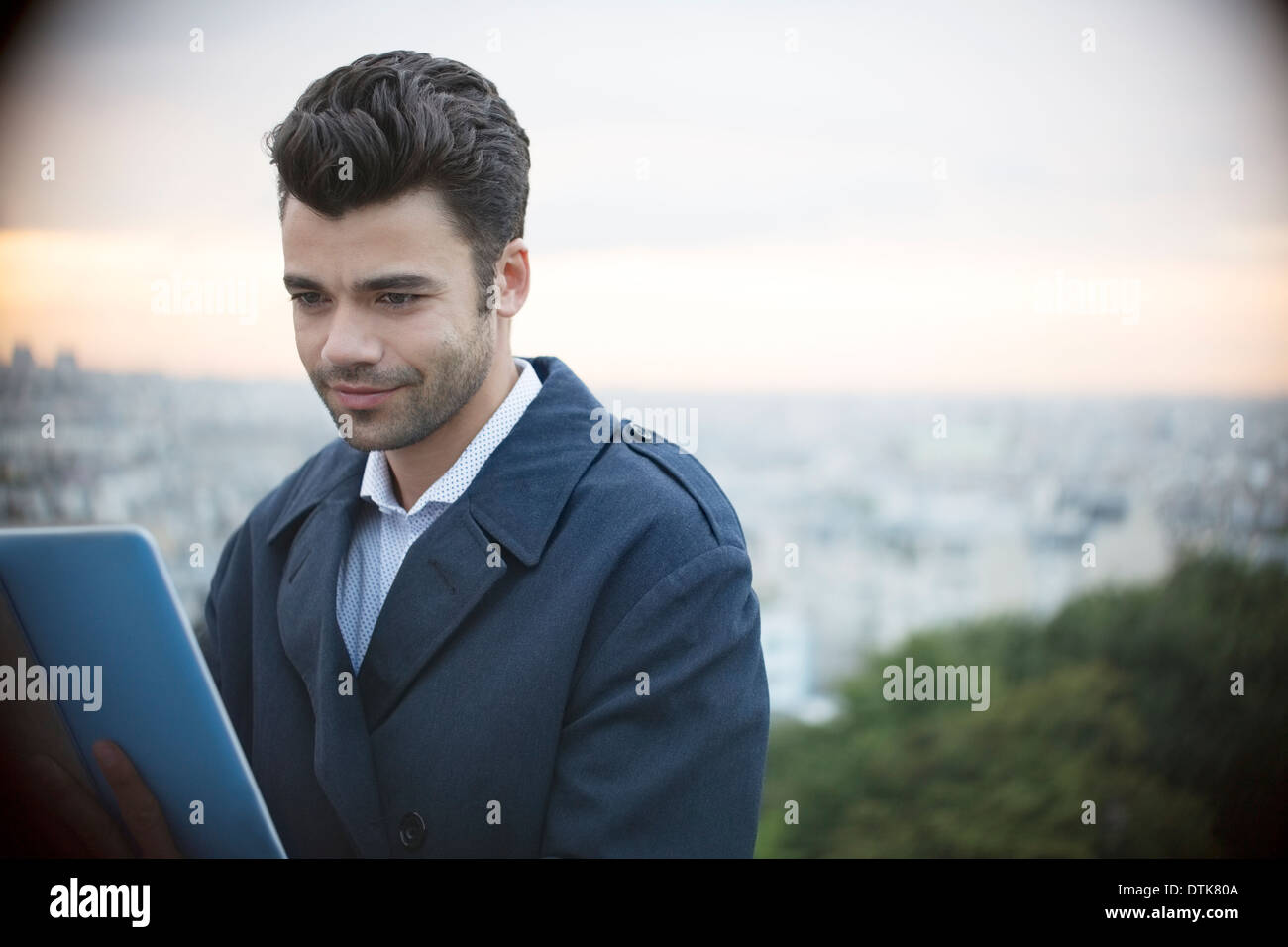 Businessman using digital tablet outdoors Banque D'Images