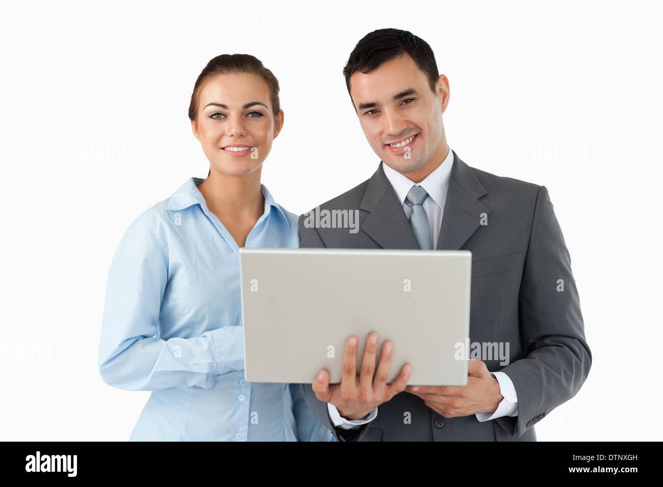 Smiling business partners with laptop Banque D'Images