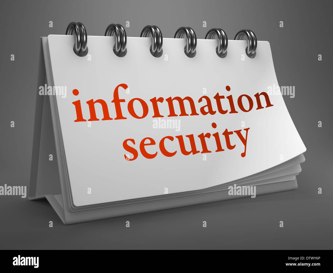 La sécurité de l'information - mots rouges sur le calendrier de bureau blanc isolé sur fond gris. Banque D'Images